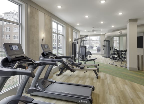 Fitness center with cardio and resistance training equipment; free weights