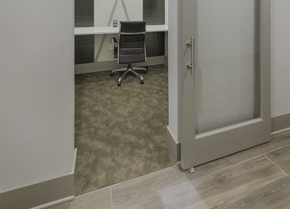 Work space in clubhouse with desk and sliding door