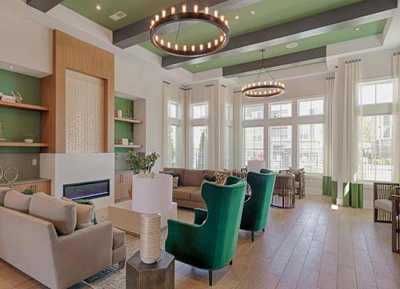 A modern living room with a fireplace and a large window.
