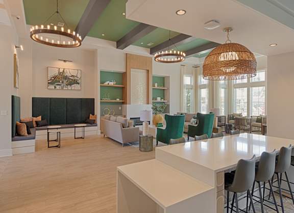 A modern kitchen with a large island and bar stools.