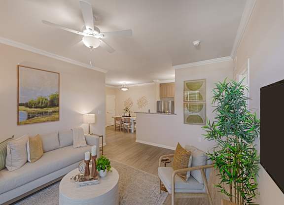 A living room with a white couch, a coffee table, and a ceiling fan.