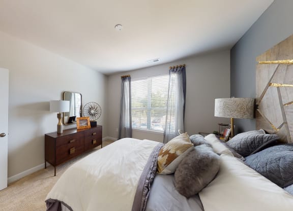 Bedroom with window; carpet