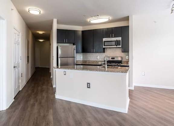 A kitchen with a refrigerator, oven, and microwave.at Riverview Landing @ Valley Forge, Eagleville, PA 19403