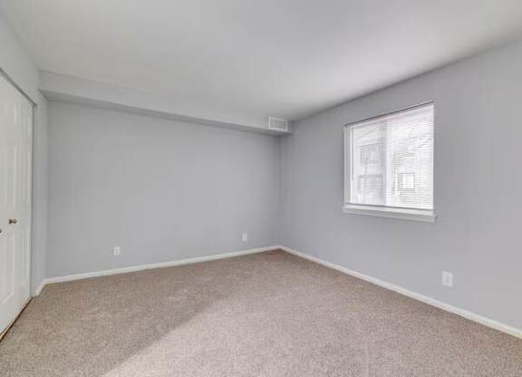 A room with a window and carpeted floor at Brookshire Trace Townhomes Apartments, Pennsylvania, 19116