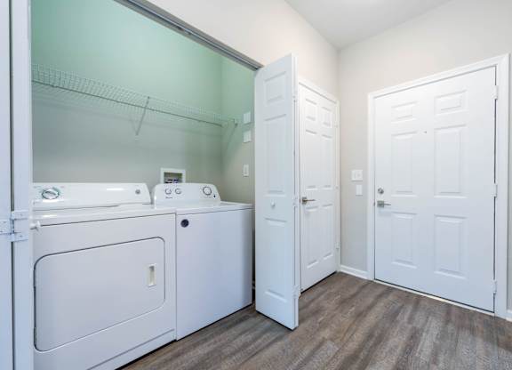 A laundry room with a washer and dryer.