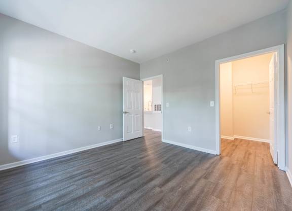 A room with a wooden floor and white walls.