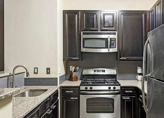 A modern kitchen with a stainless steel refrigerator, oven, and microwave.at Riverview Landing @ Valley Forge, Pennsylvania, 19403