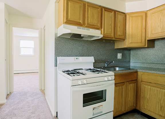a kitchen with a stove and a sink at Krewstown Park Apartments, Philadelphia, PA 19115