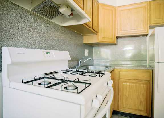 a kitchen with a stove and a sink at Krewstown Park Apartments, Philadelphia