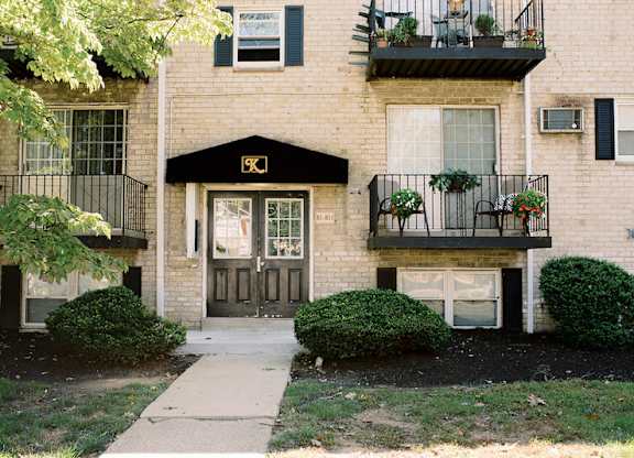the front of a brick house with a sidewalk in front of it at Krewstown Park Apartments, Philadelphia, PA