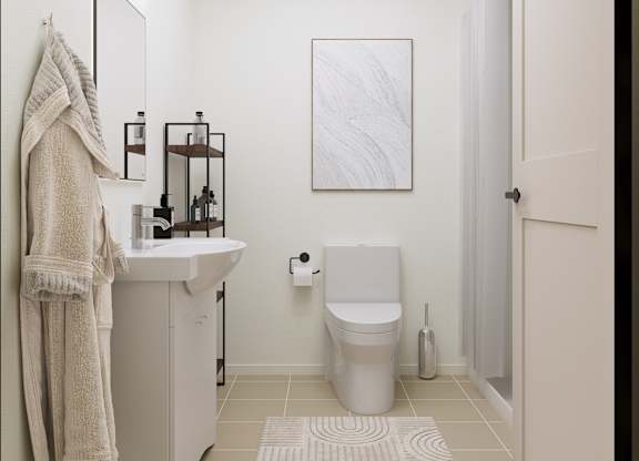 A bathroom with a towel hanging on the wall.