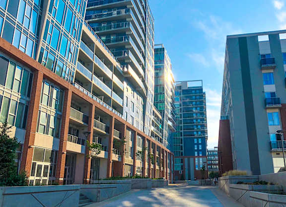 a city street filled with tall buildings and skyscrapers