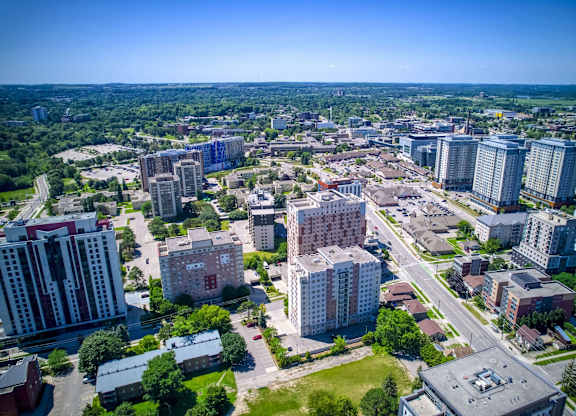 A cityscape with a mix of residential and commercial buildings.