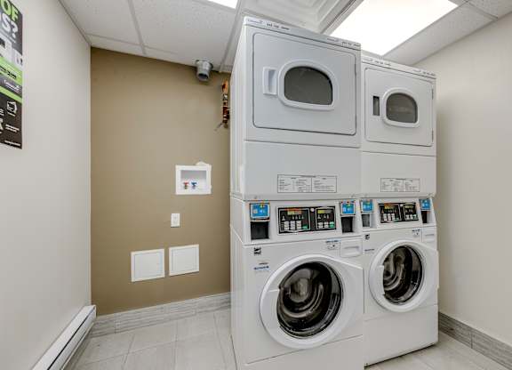 A row of washing machines in a laundromat.