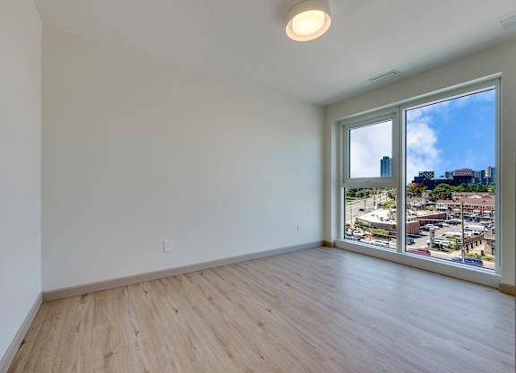 Empty room with a view of the city.