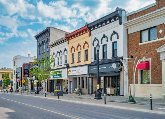 A street view of a small town with buildings on both sides.