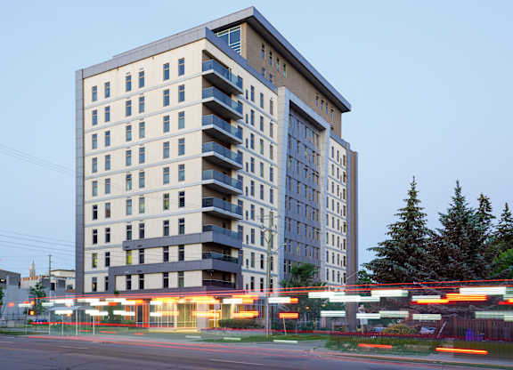 a tall building with a street in front of it