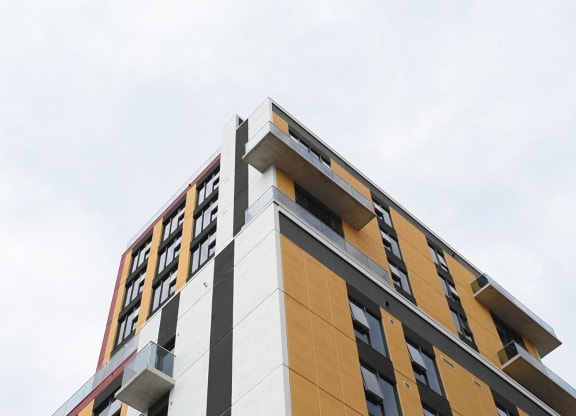 a tall building with a blue sky in the background