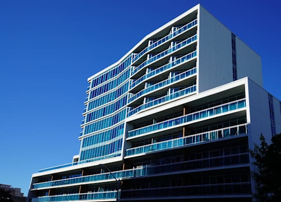 an image of a tall building against a blue sky