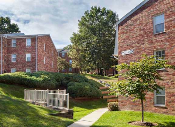 A red brick building with the number 201-205 on it.