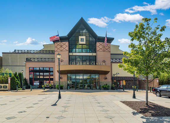 a building with two flags in front of it