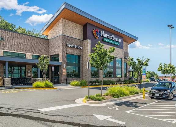 a health center building with a car parked in front of it