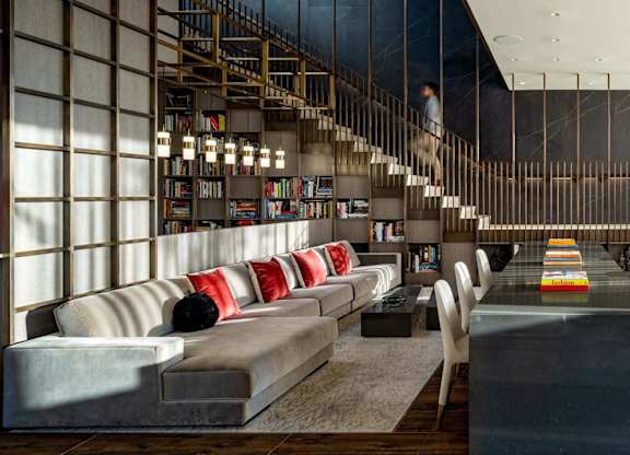 1000 South Capitol's lobby with couches and a table and a staircase.
