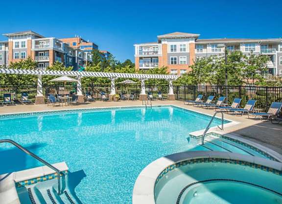 the swimming pool at the preserve at polo towers apartments tx