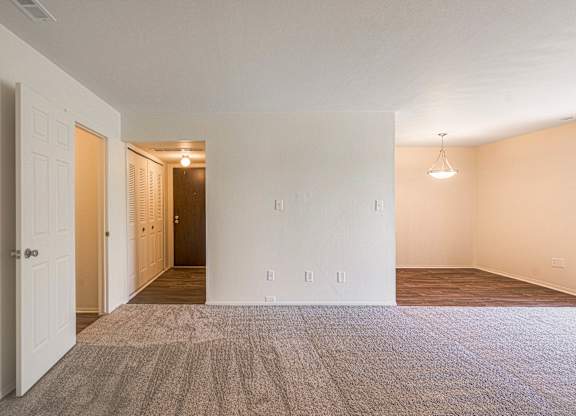 Spacious living and dining room area at Knottingham Apartments in Clinton Township, MI