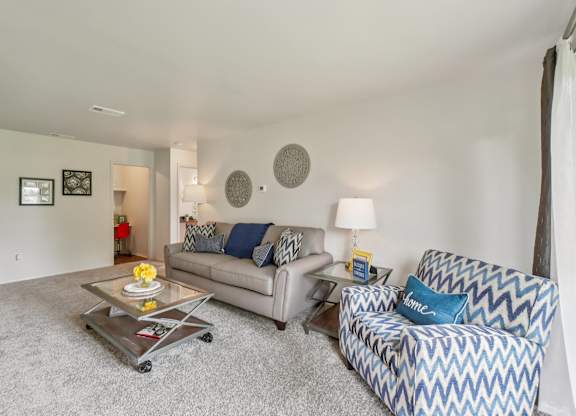 Elevated living room and private patio or balcony at Drawbridge Apartments in Harrison Township, MI.