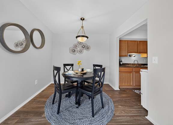 Spacious dining room area at Drawbridge Apartments in Harrison Township, MI.
