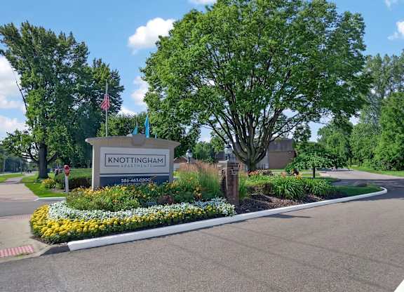 Welcoming entrance at Knottingham Apartments in Clinton Township, MI.