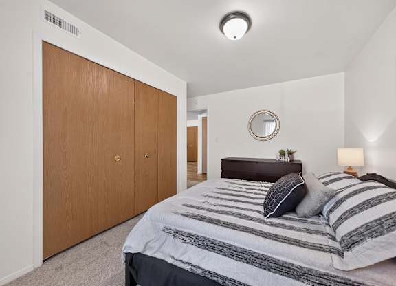 Bedroom with ample storage space at Eastwood Village Apartments in Clinton Township, MI.