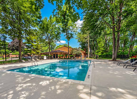 Heated swimming pool with sundeck at Eastwood Village Apartments in Clinton Township, MI.