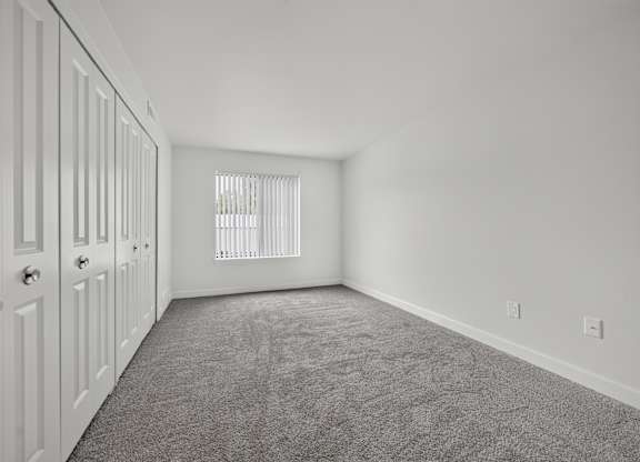Bedroom with ample storage at Franklin River Apartments in Southfield, MI.