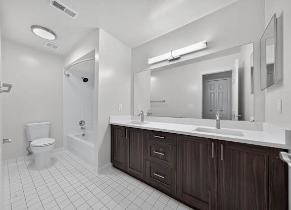 Modern bathroom with tub at Franklin River Apartments in Southfield, MI.