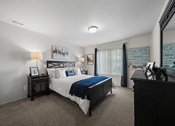 Spacious bedroom with ample storage space at Knottingham Apartments in Clinton Township, MI.