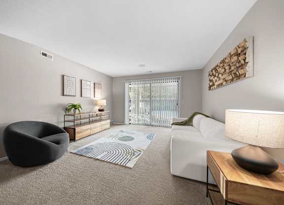 Spacious Living Room with Sliding Glass Door at Lakeside Village Apartments Clinton Township MI