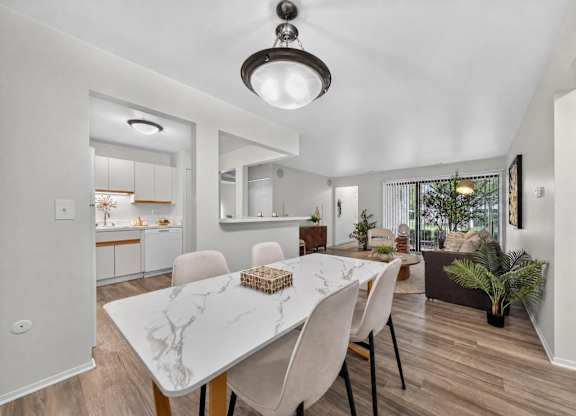 Open and airy kitchen, dining and living room space at Park Lane Apartments in Southfield, MI.