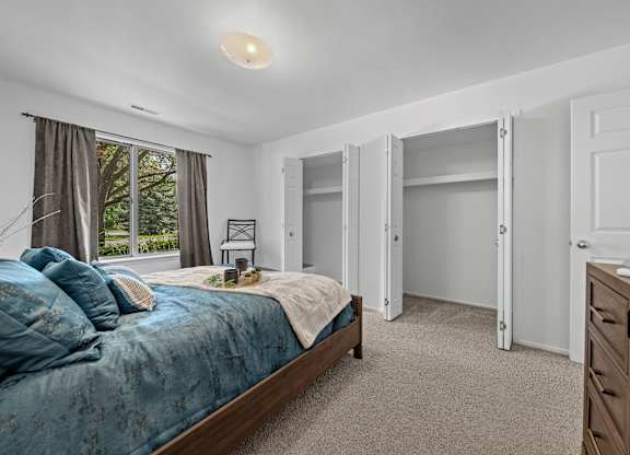 Bedroom with Ample storage space at Prentiss Pointe Apartments in Harrison Township, MI