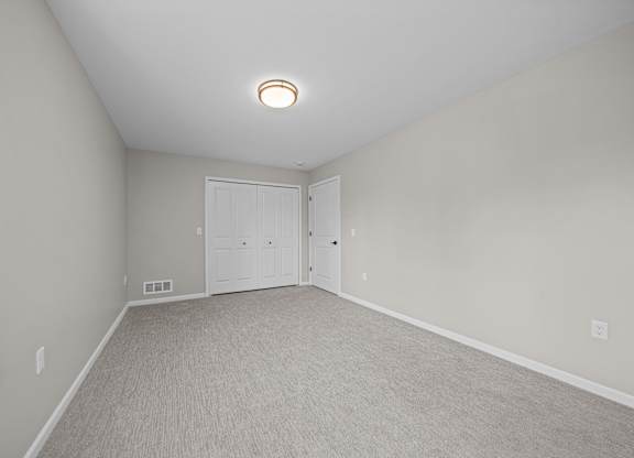 Bedroom with Ample storage space at The Reserve at Prentiss Pointe Apartments in Harrison Township, MI