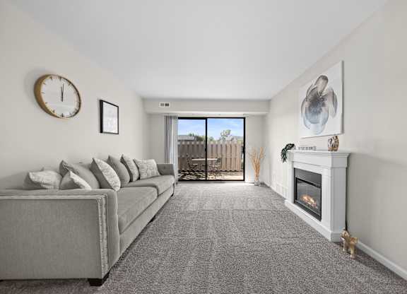 Living Room with Natural lighting  at Three Oaks Apartments in Troy, MI