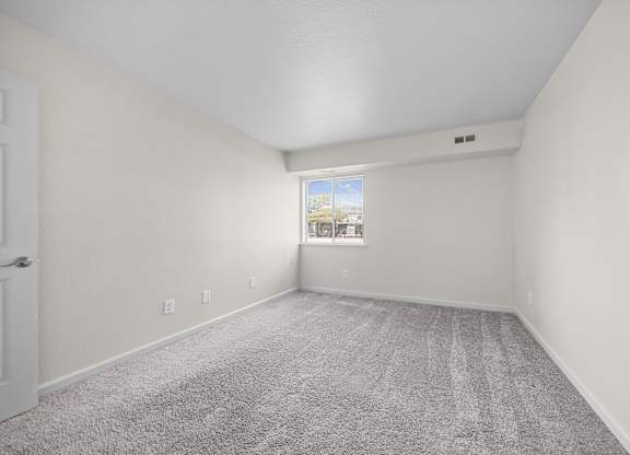 Large bedroom at Three Oaks Apartments in Troy, MI