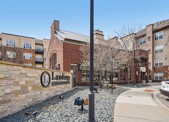 The image shows a building with the name "Landings" on a wall.