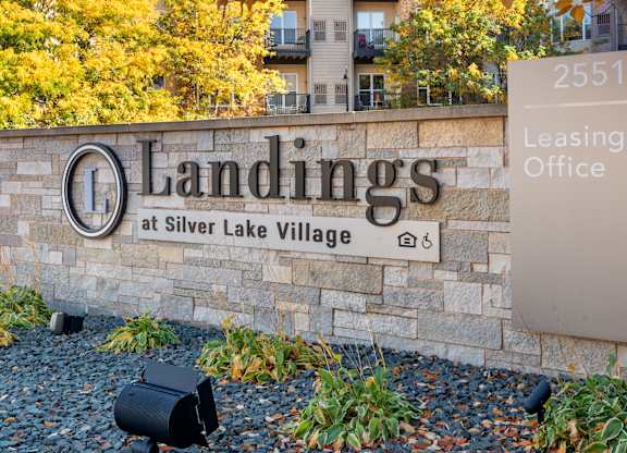 A sign for Landings at Silver Lake Village leasing office.