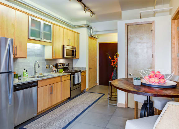 Kitchen with Refrigerator at Arcade Artist Apartments, St Louis, MO