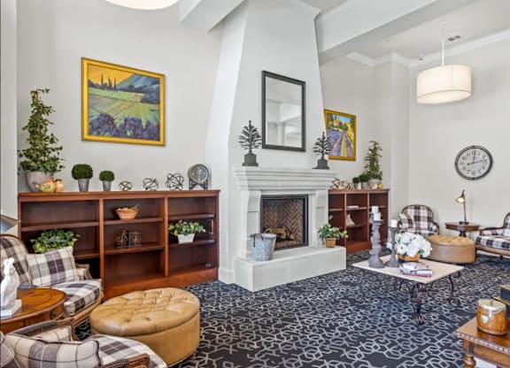 a living room filled with furniture and a fireplace at Cypress Creek at River Oaks, Waxahachie