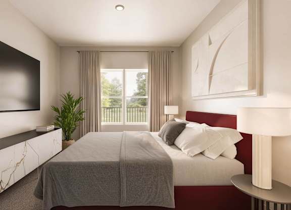 A bedroom with a large bed and a flat screen TV mounted on the wall at Sage at Franklin Park Apartment , Austin