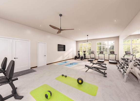 A spacious home gym with a variety of exercise equipment at Sage at Franklin Park Apartment , Austin, Texas