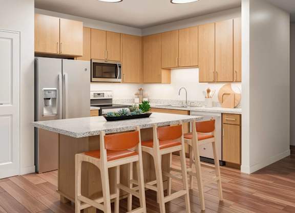 A kitchen with wooden cabinets and a marble countertop at Sage at Franklin Park Apartment , Austin, 78744